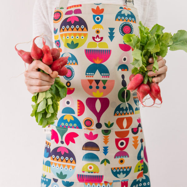 Cooking apron combining Scandinavian shapes and colours with Eastern European folklore. Inspired by retro Christmas tree baubles. Available in two colours. This is the 